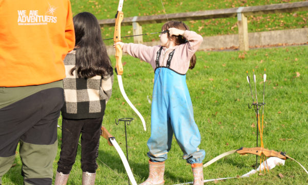 An image of a child taking part in archery.