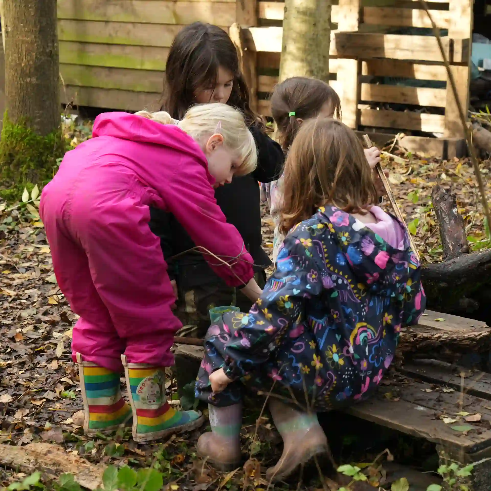 A group of children working together during forest school.